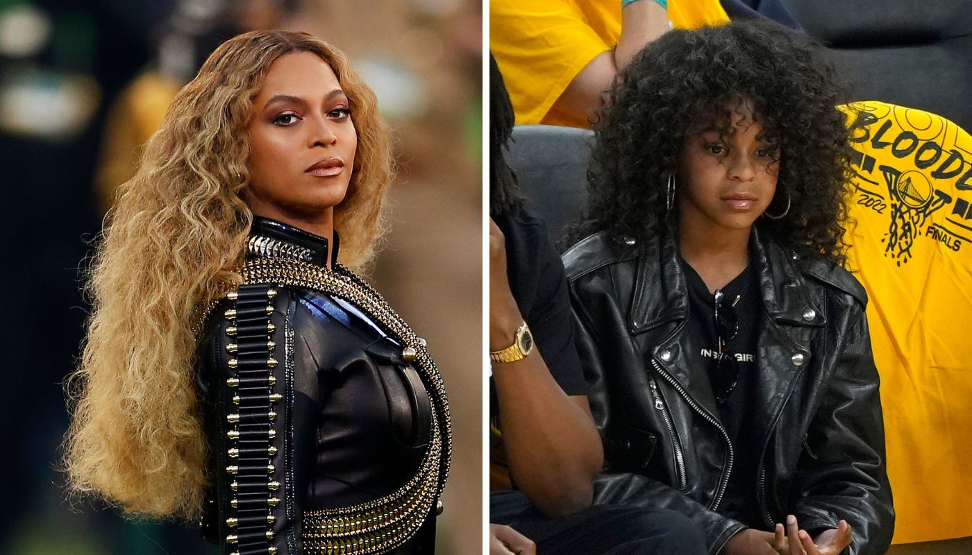 Beyoncé e Blue Ivy tiram fotos durante partida da NBA, em 2018.