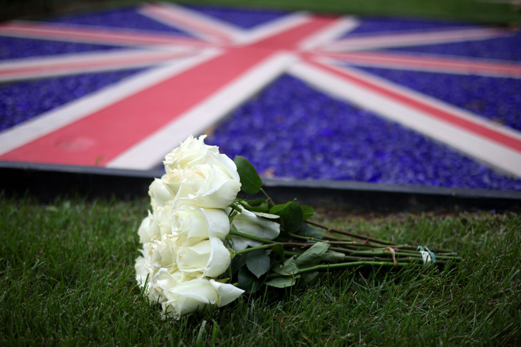 WASHINGTON, DC - SEPTEMBER 8: Flowers laid in tribute at the British Embassy after the death of Queen Elizabeth II was announced on September 8, 2022 in Washington, DC. Elizabeth Alexandra Mary Windsor was born in Bruton Street, Mayfair, London on 21 April 1926. She married Prince Philip in 1947 and acceded the throne of the United Kingdom and Commonwealth on 6 February 1952 after the death of her Father, King George VI.Queen Elizabeth II died at Balmoral Castle in Scotland on September 8, 2022, and is survived by her four children, Charles, Prince of Wales, Anne, Princess Royal, Andrew, Duke Of York and Edward, Duke of Wessex. (Photo by Win McNamee/Getty Images)